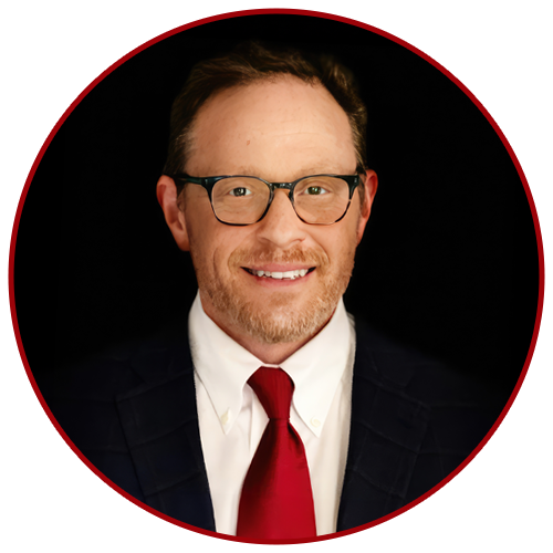 Dr.-Sigel Dr. Herrick J. Siegel in a dark suit and red tie